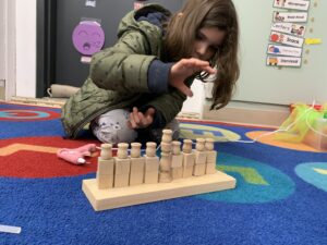 Student crafting a menorah at B'ShERT